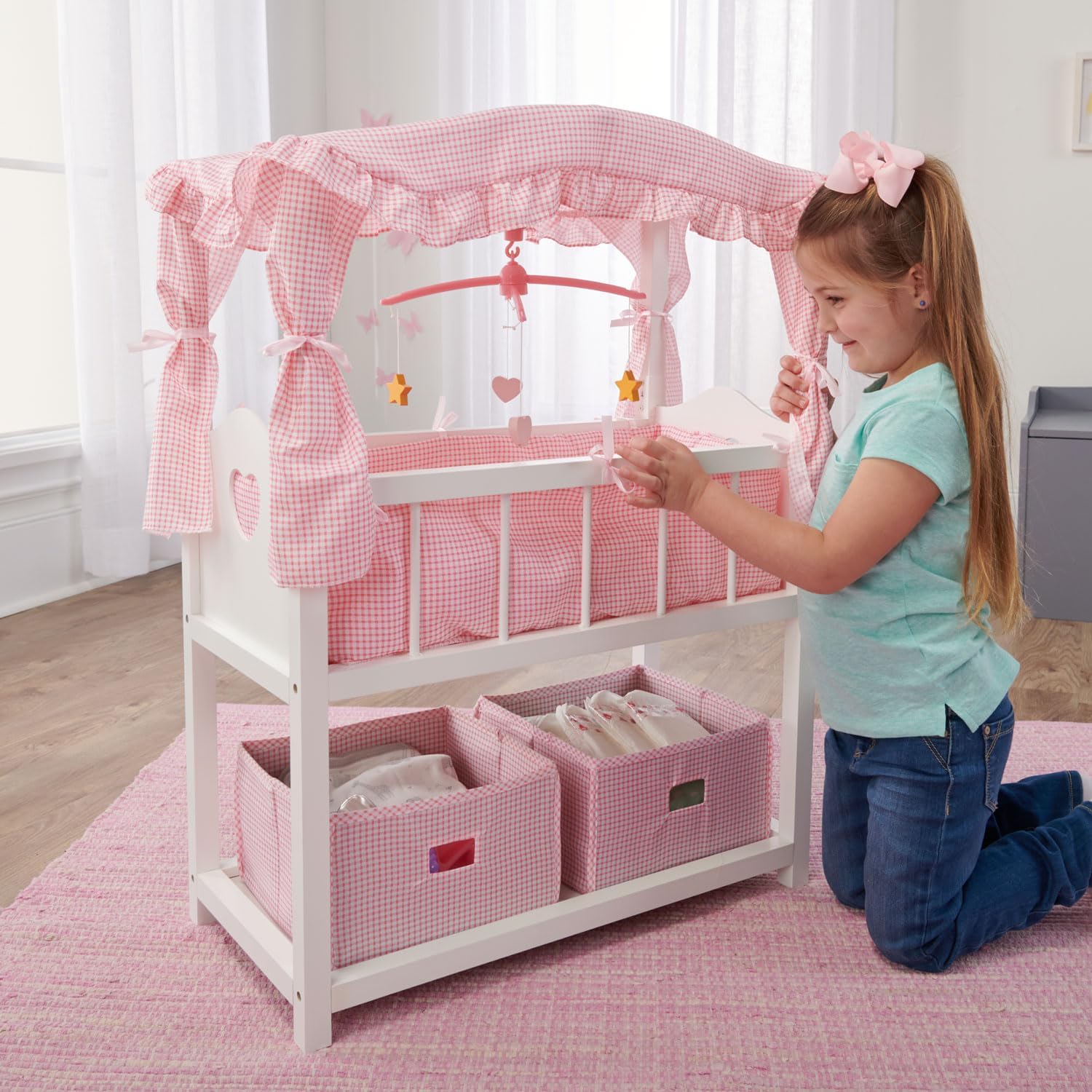 Badger Basket Toy Doll Bed with Storage Baskets and Musical Mobile, White/Pink R614082